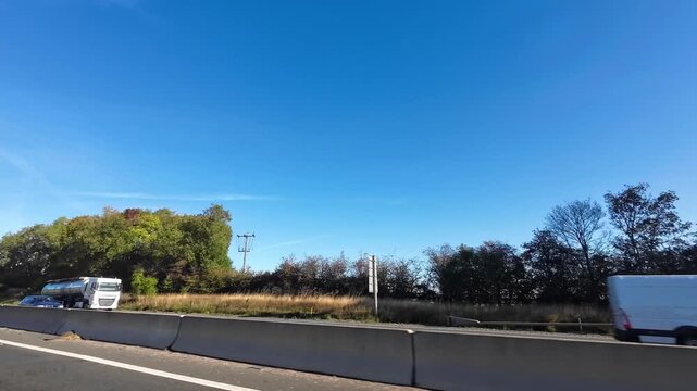 Car Drive on British Highways. Car Mounted Camera Time Lapse Footage of British Road Travel and Traffic During Blue Sky and Mostly Sunny Day Drive on British Motorways and Highways of England UK