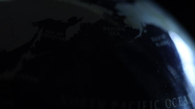Zoom on Bering straight and the Gulf of Alaska. Earth from orbit, rotation. Country borders. Earth globe map. North Pacific from space