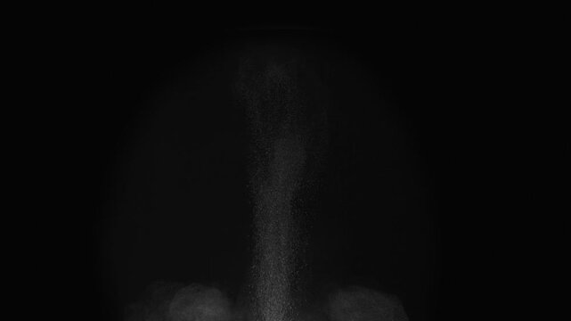 Projectile Impact on the Ground. A column of soil and dust rises into the air from the explosion. Isolated on black. Use in blend modes to simulate a battlefield