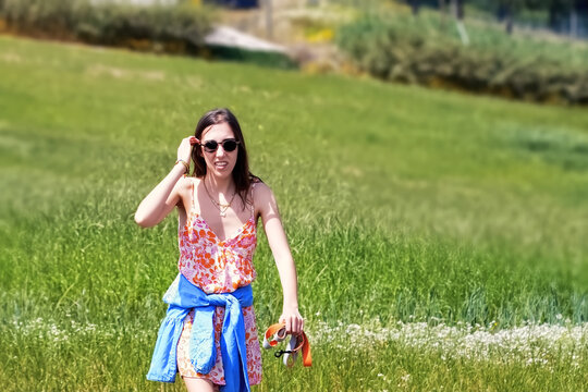 Young beautiful woman in summer dress