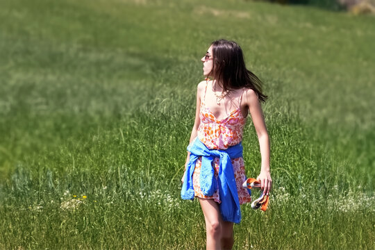 Young beautiful woman in summer dress