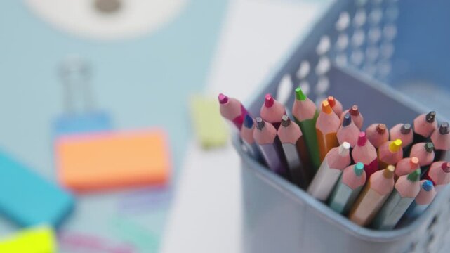 Close Up of Colored Pencils Arranged in a Pencil Case on a Blue Desk, Showcasing Back to School, School Stationery, Art Supplies, and Classroom Essentials