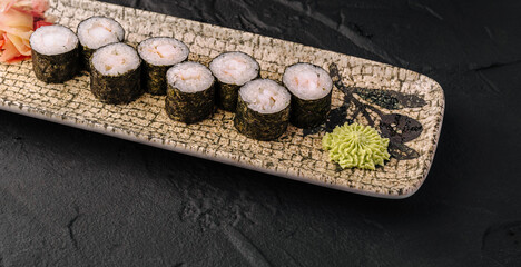 Shrimp maki sushi rolls with wasabi and ginger © AntAlexStudio