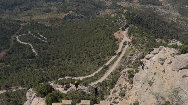 Aerial View of Climbers Crossing a Tibetan Bridge