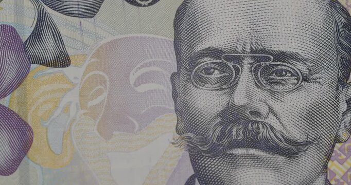 Detailed view of the portrait of Ivan Vazov, a renowned Bulgarian writer, depicted on a fifty Bulgarian lev banknote, highlighting the intricate engraving and design elements of the currency