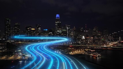 San Francisco smart city skyline glows at night as 5G and 6G digital network trails flows through the futuristic downtown © TechAnimationStock