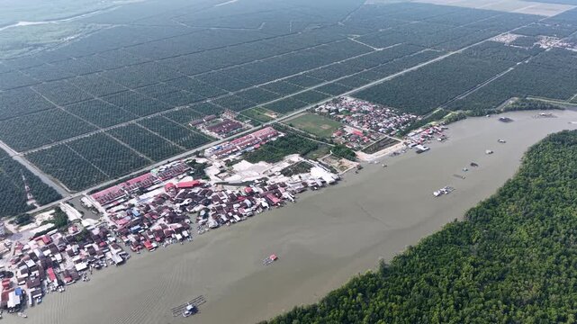 Aerial drone view of Kuala Gula riverfront town