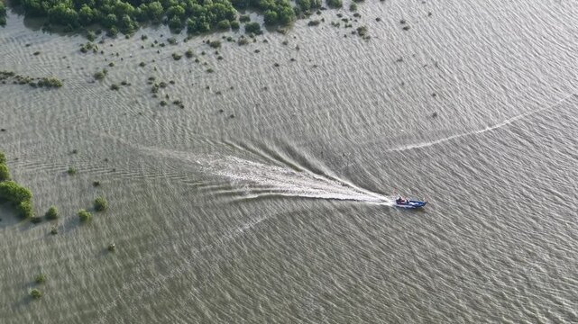 Aerial view of fisherman boat moving at sea