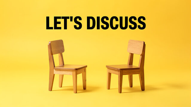 Two wooden chairs facing each other on yellow background with Let's Discuss text