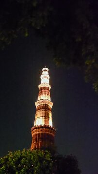 Vertical Night View of Illuminated Qutub Minar Delhi India