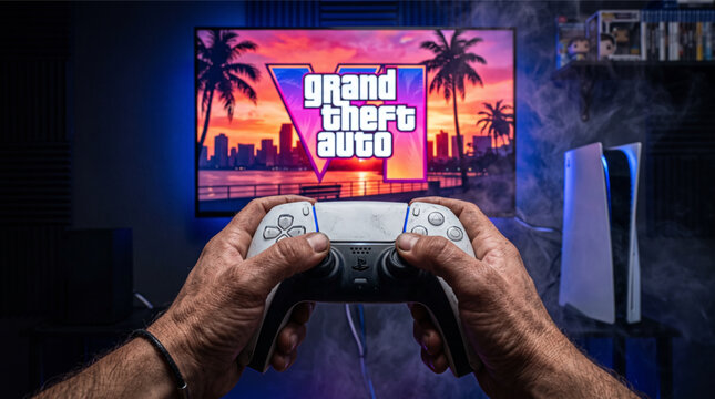 New upcoming Rockstar game GTA VI. Point of view playing Grand Theft Auto VI (6) on PlayStation 5 console with DualSense controller in home gaming setup. POV shot of person holding gamepad in hand.