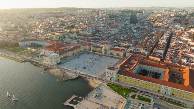 Slow panoramic drone shot of Praca do Comercio in Lisbon, Portugal during sunset