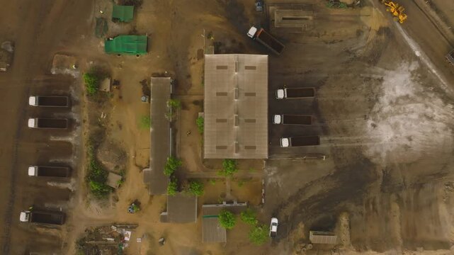Thar mining project in Sindh, Pakistan, industrial activity with trucks and heavy machinery from an aerial perspective. Resource extraction, energy development, and the environmental impact
