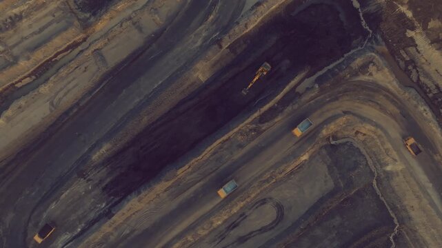 Expansive aerial view showcasing the massive Thar mining project in Sindh, Pakistan, with large trucks and excavators at work.