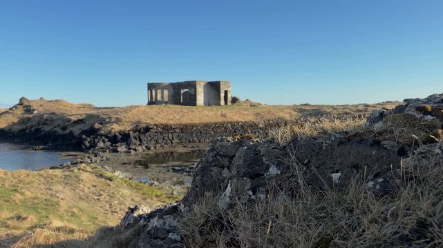 Abandoned Building In Hopsnes, Iceland On A Sunny Day. - aerial shot