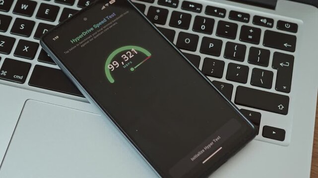 Close up of mobile application benchmarking ultra high speed connection with cosmic speed confirmed
