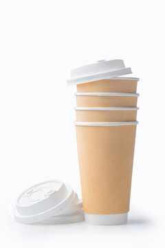 Disposable paper takeaway coffee cups isolated on white background