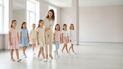Fototapeta premium Girls at a modeling academy building confidence through practice