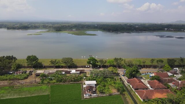 Aerial view of Mulur Reservoir, a natural tourist destination and reservoir, a Dutch heritage site built in 1926 in Sukoharjo, Central Java, Indonesia.