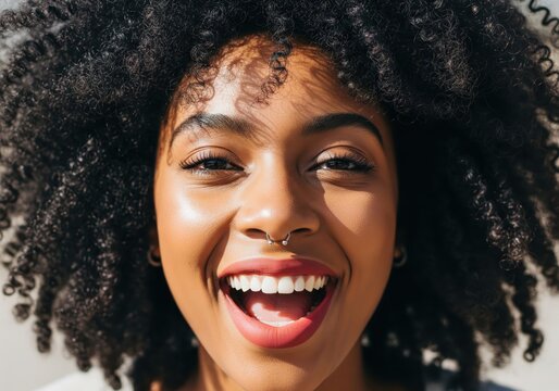 Close Up Portrait of Smiling Woman With Natural Curly Hair