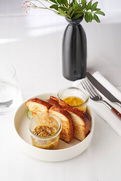 Homemade bread served with pickled cucumber and artisanal dips , perfect for a brunch cafe menu or artisanal bakery offering