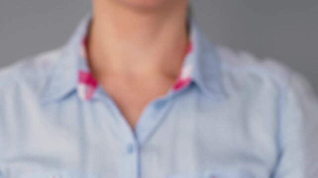 Close-up of a woman breaking a cigarette with her hands as a symbol of quitting smoking, tobacco cessation, healthy lifestyle, nicotine addiction recovery, and disease prevention.