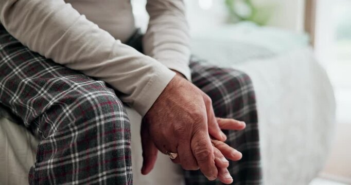 Close-up of a senior adult holding a painful hand due to arthritis, joint inflammation, or chronic hand pain. Concept of aging, musculoskeletal disorders, healthcare, pain management, elderly wellness