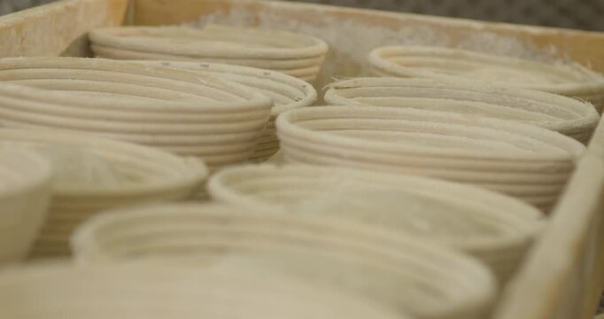 Close up view of empty wicker fermentation baskets for bread dough in bakery workshop