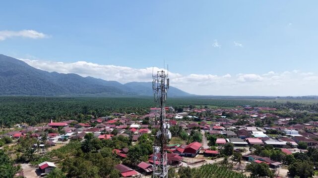 Aerial view captures telecom tower above village at Sagil, Johor