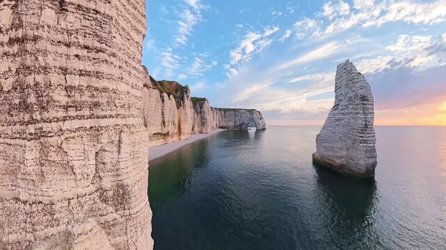 Majestic Etretat arches and chalk cliffs at sunrise in France