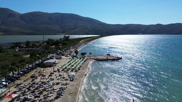 Aerial view of the turquoise Mediterranean coastline connecting Vlore, Radhime and Orikum, Albania