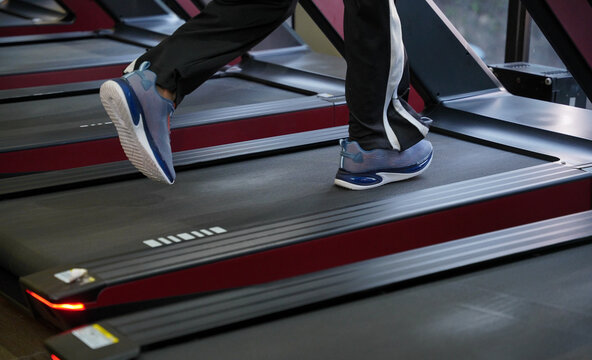 Maharashtra, Sion, India- 22nd March 2026- Close shot of an Indian guy's legs, while running on a cardio machine.