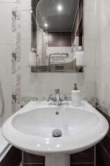 Fototapeta premium Bathroom Interior with Ceramic Washbasin Sink and Mirror close up