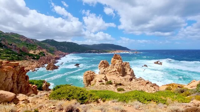 Beautiful turquoise sea with amazing waves and rock formations at Li Cossi beach, in sunny summer day, in Sardinia, Italy