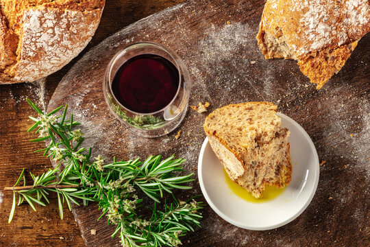 Homemade artisan sourdough bread loaf on a rustic wooden cutting board