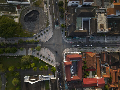 Aerial view of Titik Nol Kilometer Yogyakarta intersection with historic buildings, trees, and urban road layout in Kecamatan Gondomanan, Daerah Istimewa Yogya, Indonesia.