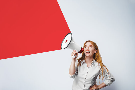 A woman with a megaphone. Promotion, action success business with isolated free copy space background.