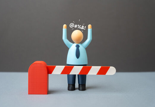 Office worker behind a closed barrier. Dismissal from work and denied access to the workplace. Banned from work networks and chats.