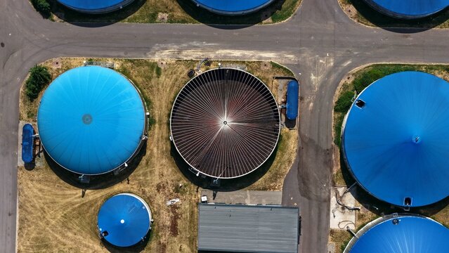 Top Down Aerial View of Blue Biogas Digesters and Open Tank