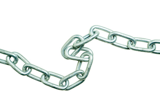 A close-up view of sturdy metal chain links isolated on a solid black background, showcasing strength, connection, and industrial texture