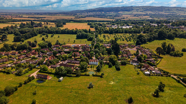 Wick village aerial view with traditional houses and surrounding countryside fields