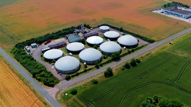 Drone Aerial Video of White Dome Biogas Plant in Golden Fields