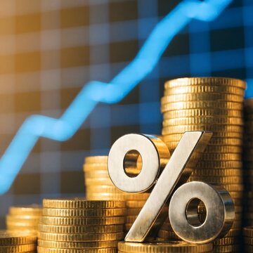 A silver percentage symbol and ascending stacks of golden coins against a blurred upward-trending financial graph, representing investment growth, interest rates, and economic success.