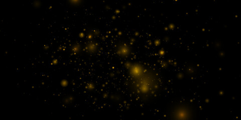 Elegant golden particles shimmer with soft glowing highlights. Sparkling dust forms a beautiful transparent overlay full of festive charm. Great for advertising, greeting cards, and web graphics. © Alexei