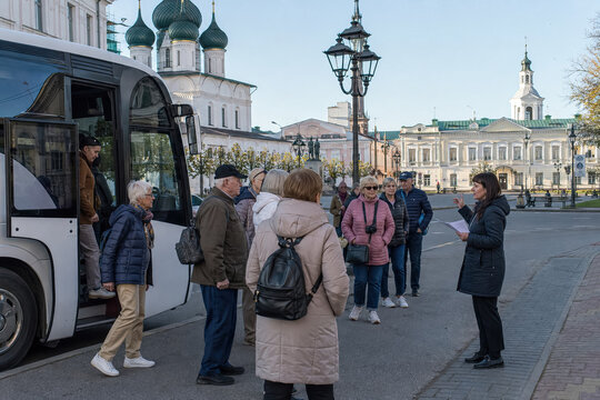 Tourists waiting near bus in historic Russian square with church domes.generative AI