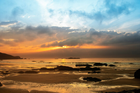 Golden Sunset Over Rocky Beach Near Cabo de Pe&ntilde;as in Asturias Spain