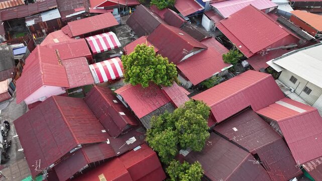 Aerial drone view of red roofs in jelutong penang old houses