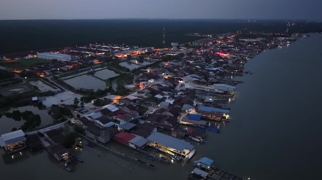Aerial night view of Kuala Gula fishing village coastline