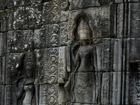 Ancient Devata Stone Carving on Sandstone Wall at Banteay Kdei Temple, Angkor, Cambodia