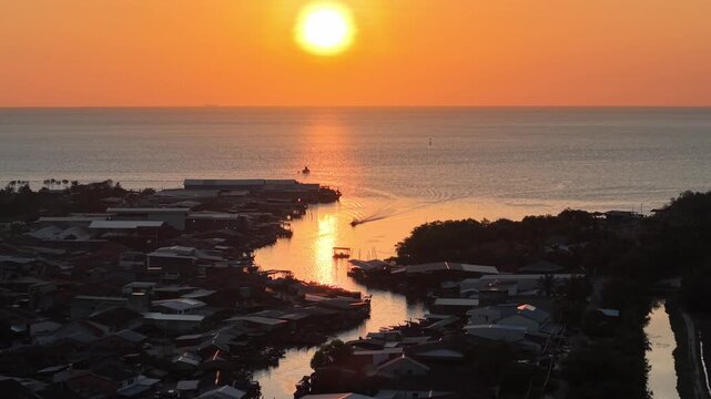 Sunset over Tanjung Piandang coastal fishing village